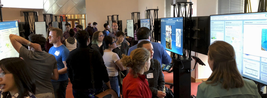 People talking and networking during digital posters session